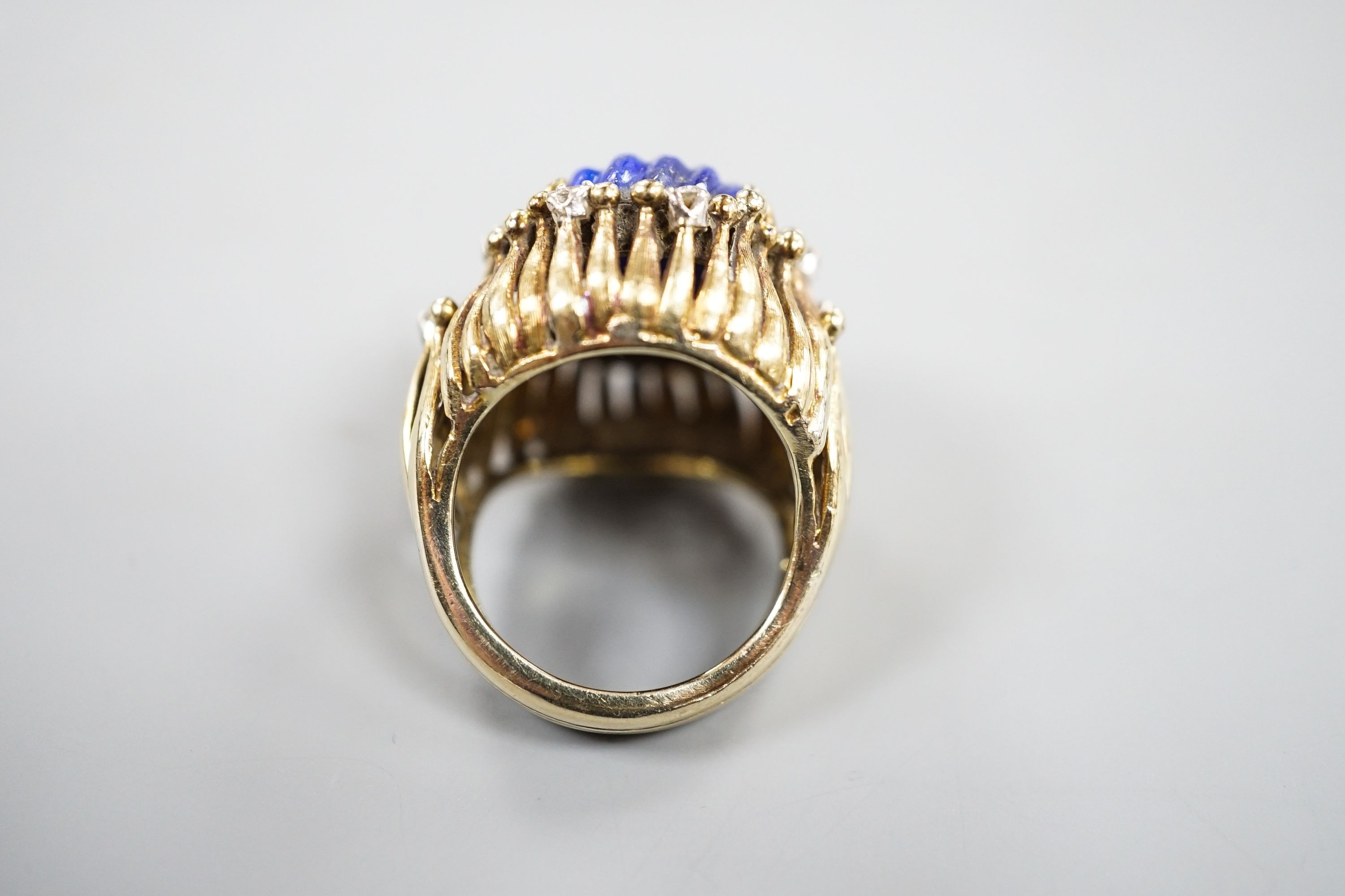 A pierced fluted 14k yellow metal, lapis lazuli and diamond set modernist dress ring, size K/L, gross weight 15.3 grams.